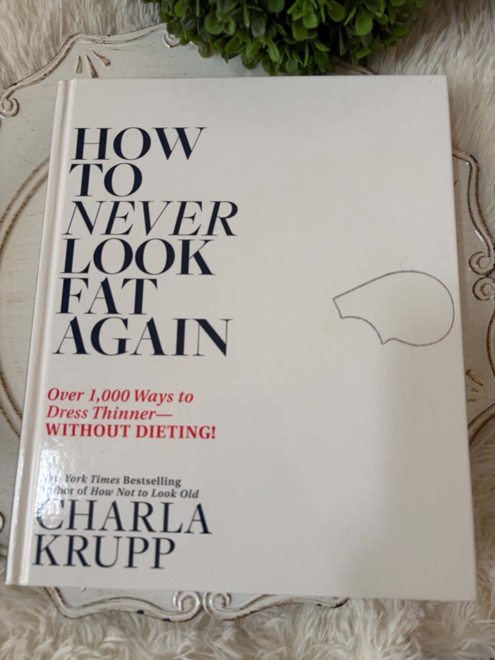 How to Never Look Fat Again by Charla Krupp - White & Blue Hardcover Book